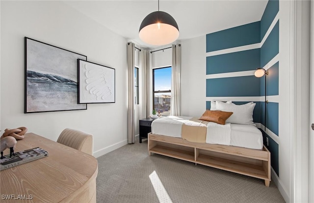 carpeted bedroom featuring baseboards