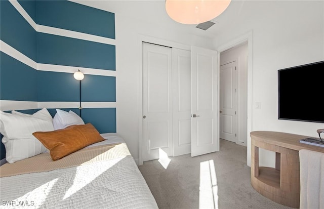 bedroom with carpet floors and a closet