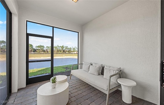 sunroom with a water view