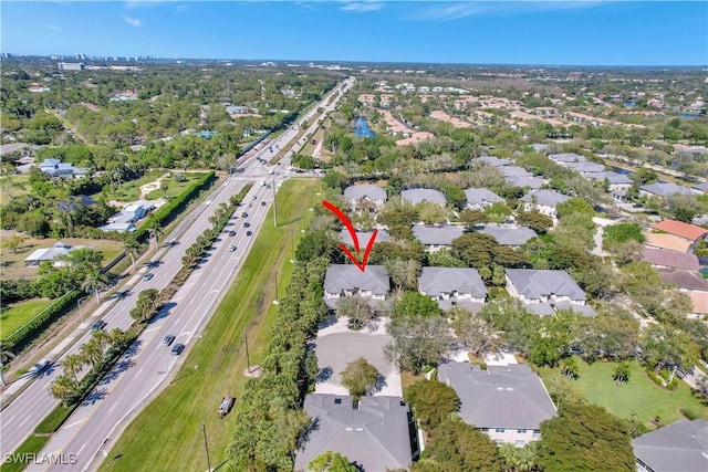 birds eye view of property with a residential view