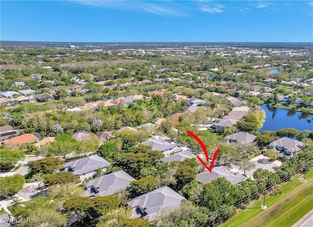 bird's eye view featuring a residential view and a water view