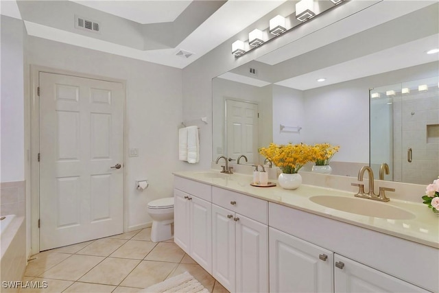 full bath with a sink, visible vents, a stall shower, and tile patterned floors