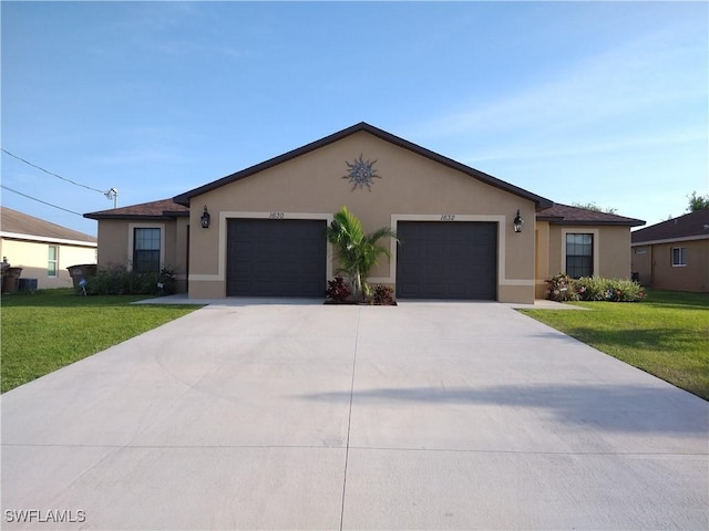 single story home featuring an attached garage, a front yard, and stucco siding