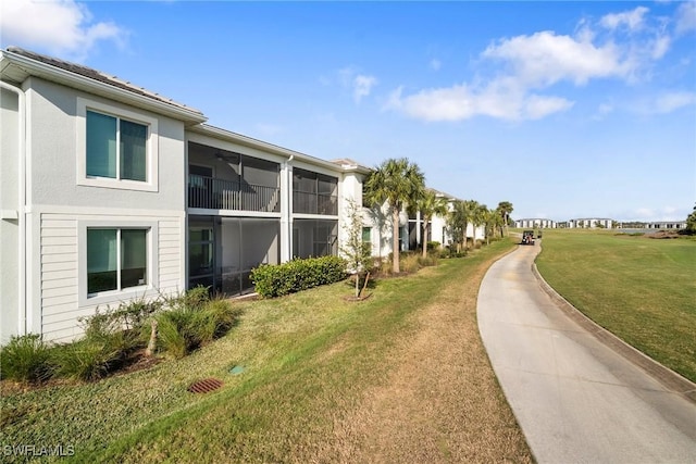 view of property's community with a lawn