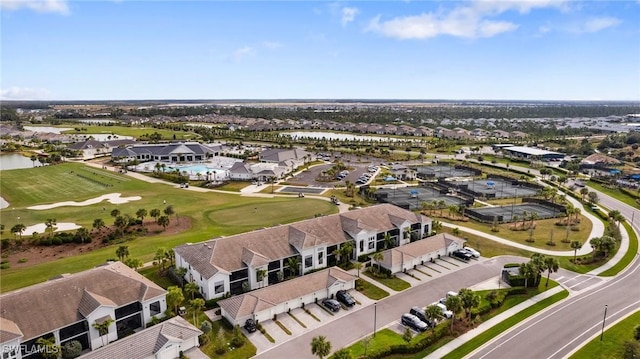 birds eye view of property featuring a residential view, a water view, and golf course view