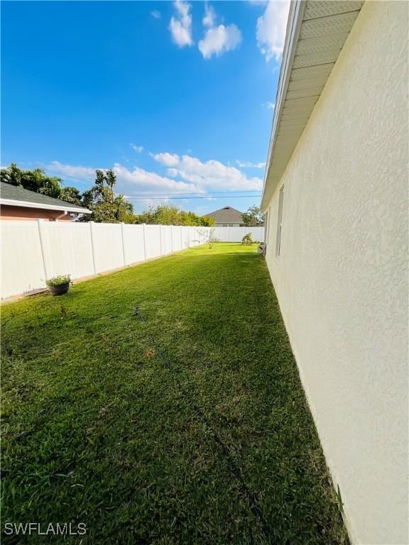 view of yard with a fenced backyard