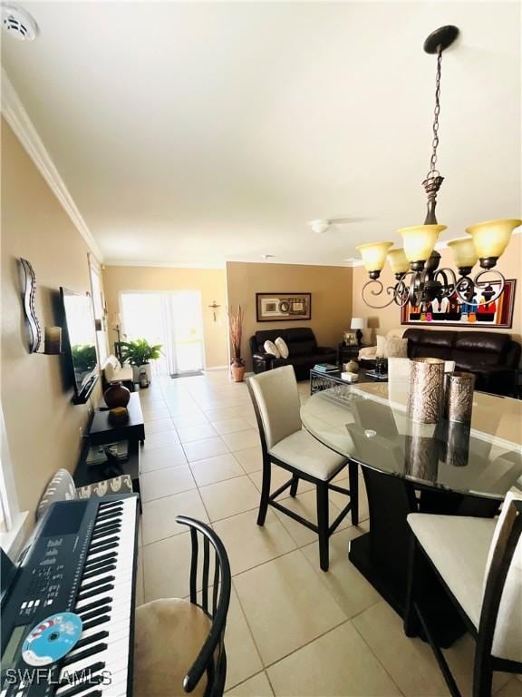 dining area featuring a chandelier, crown molding, and light tile patterned floors