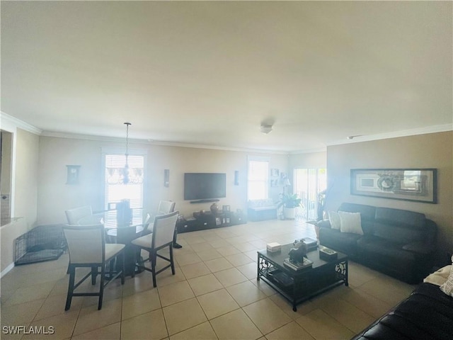 living room with ornamental molding, a healthy amount of sunlight, and light tile patterned flooring