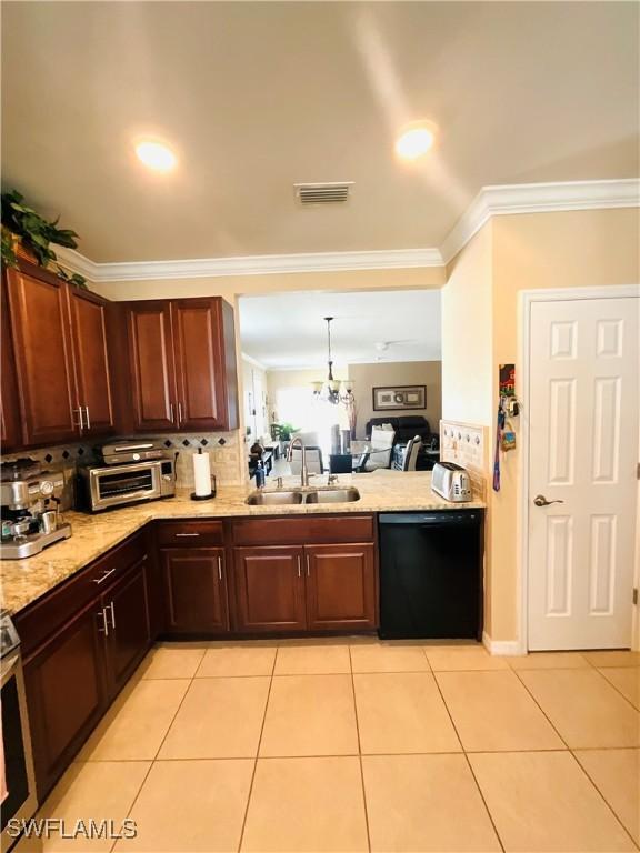 kitchen featuring light tile patterned floors, visible vents, dishwasher, crown molding, and a sink