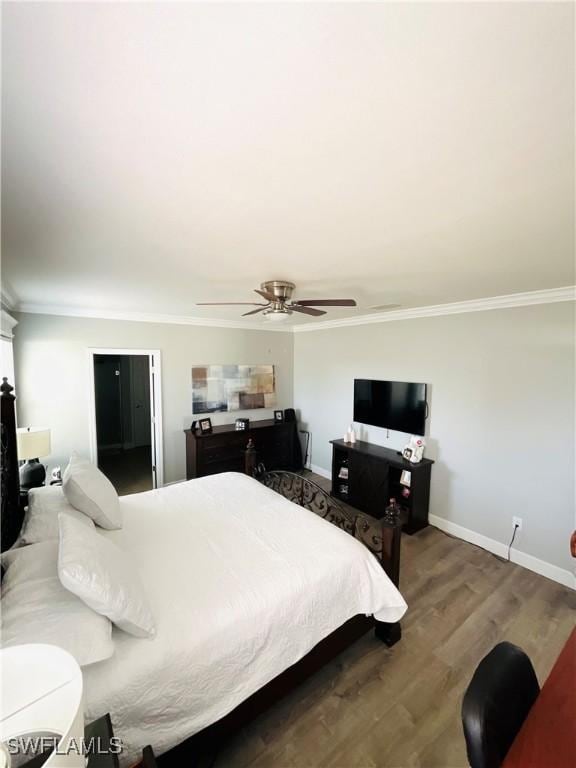 bedroom featuring ceiling fan, ornamental molding, wood finished floors, and baseboards