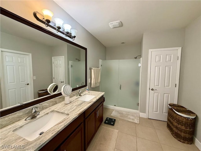 full bathroom with a shower stall, tile patterned flooring, double vanity, and a sink
