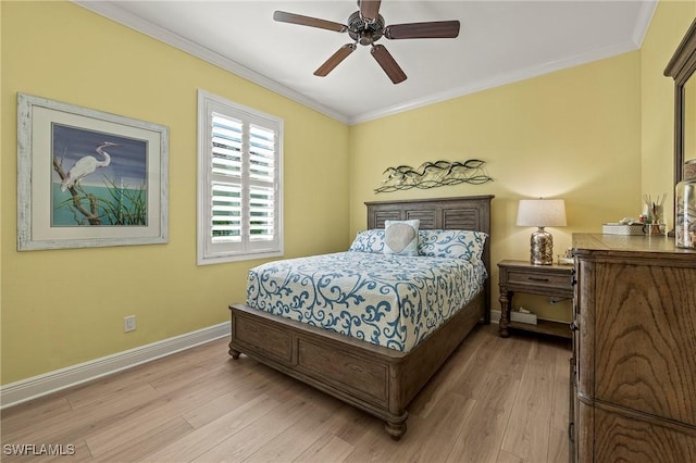 bedroom with light wood-type flooring, baseboards, ornamental molding, and ceiling fan