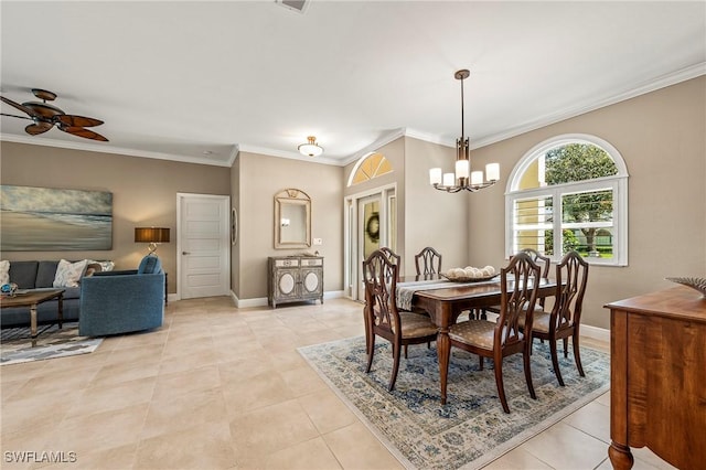 dining room with ceiling fan with notable chandelier, baseboards, ornamental molding, and light tile patterned flooring