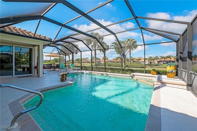 pool with a patio area and a lanai