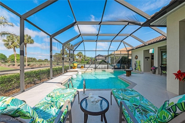 outdoor pool featuring glass enclosure and a patio area