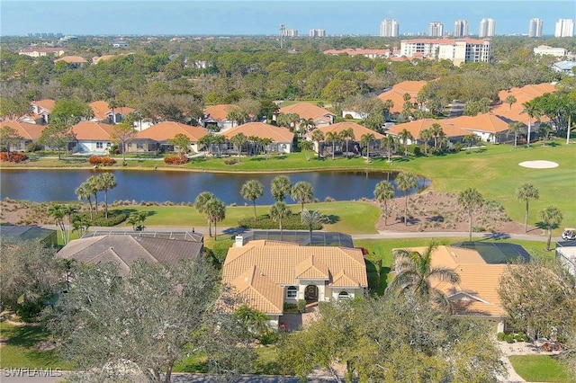 birds eye view of property with a water view and a residential view