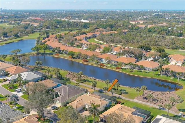 birds eye view of property featuring a water view and a residential view