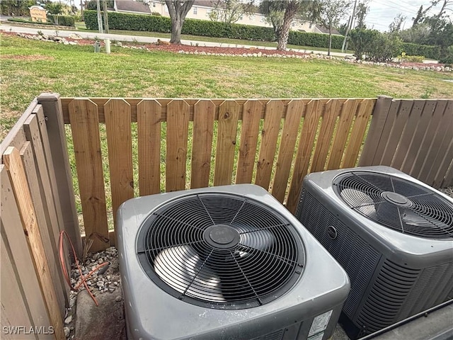 details with central air condition unit and fence