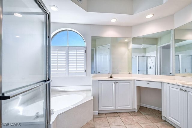 full bath with vanity, recessed lighting, a stall shower, a garden tub, and tile patterned floors