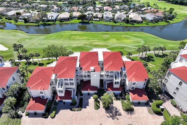 birds eye view of property with a residential view, view of golf course, and a water view
