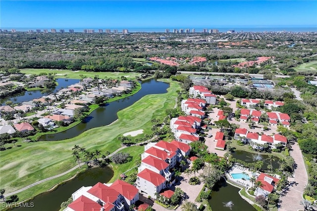 aerial view featuring a water view and view of golf course