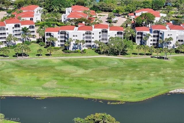 aerial view featuring view of golf course and a water view
