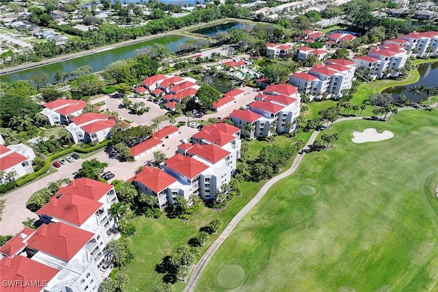 bird's eye view with a residential view, golf course view, and a water view