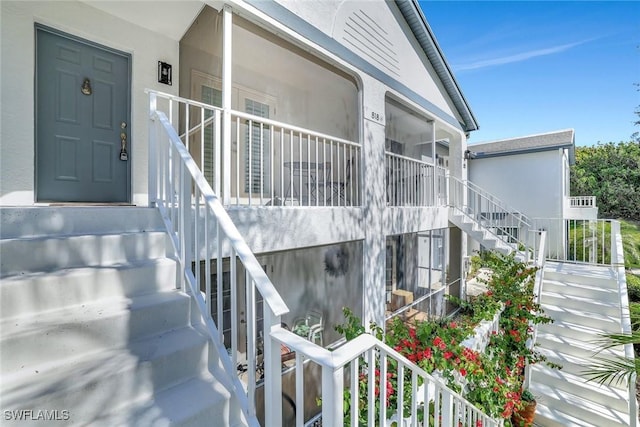 view of exterior entry with a porch