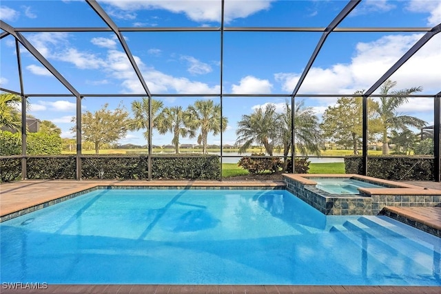 view of swimming pool featuring glass enclosure, a water view, and a pool with connected hot tub