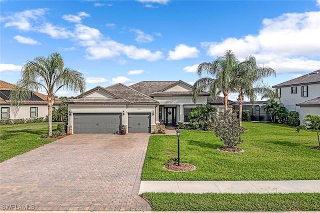 view of front of home featuring an attached garage, a front lawn, decorative driveway, and stucco siding