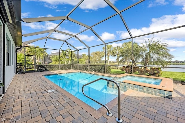 view of swimming pool with a lanai, a patio area, and a water view