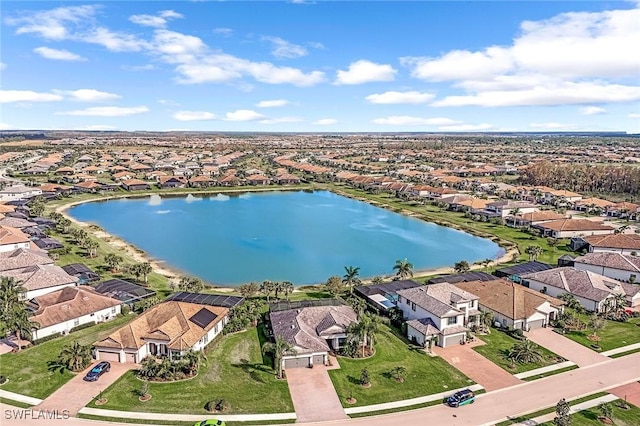bird's eye view featuring a residential view and a water view
