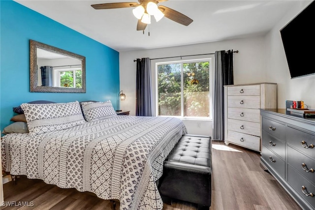 bedroom with ceiling fan and wood finished floors