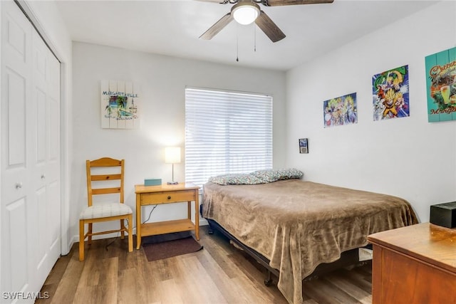 bedroom with a closet, a ceiling fan, and wood finished floors