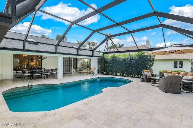 outdoor pool with glass enclosure, outdoor lounge area, and a patio