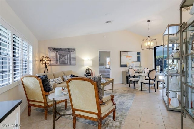 interior space with vaulted ceiling, a notable chandelier, and a healthy amount of sunlight