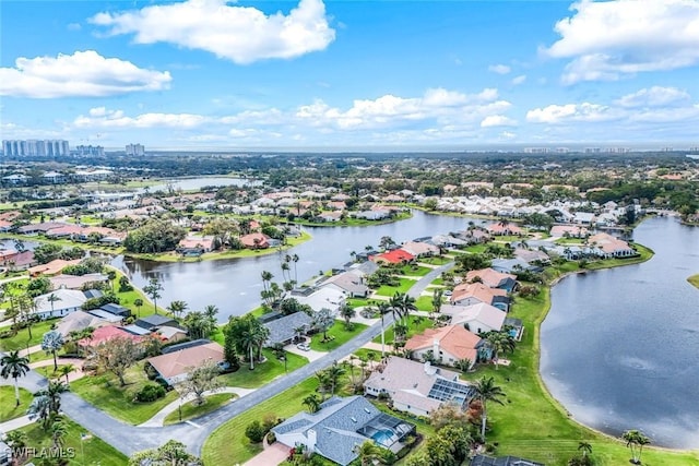 aerial view featuring a water view and a residential view