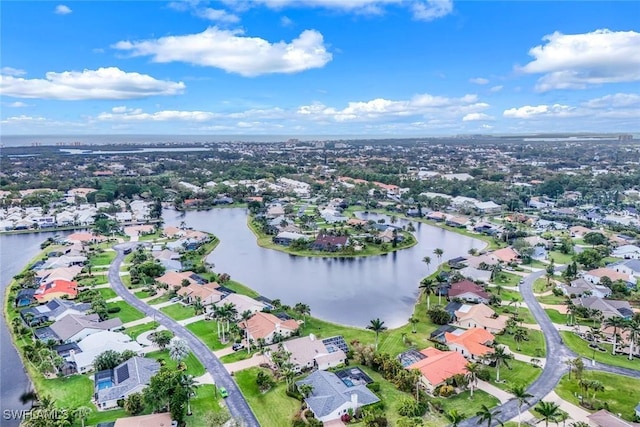 bird's eye view featuring a residential view and a water view