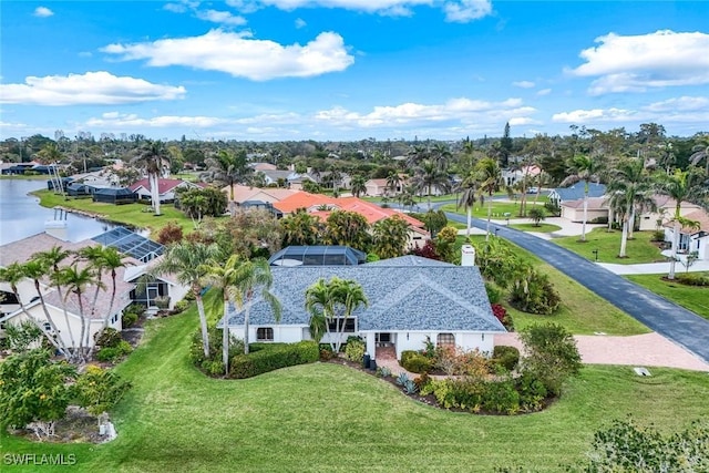 bird's eye view with a water view and a residential view