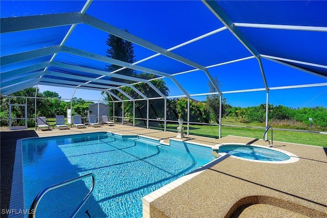 view of pool featuring glass enclosure, a pool with connected hot tub, and a patio