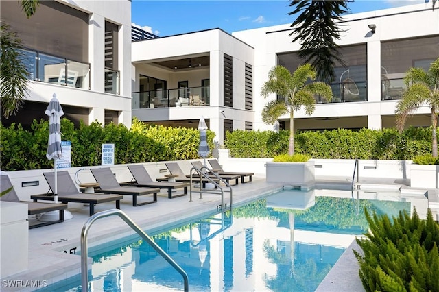 community pool featuring a patio area