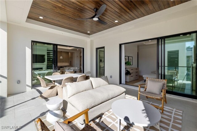 view of patio / terrace featuring ceiling fan, an outdoor living space, and outdoor dining space