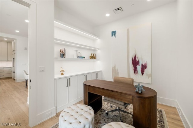 office with recessed lighting, visible vents, light wood-style flooring, and baseboards