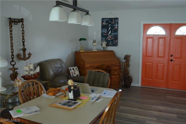 dining space featuring wood finished floors