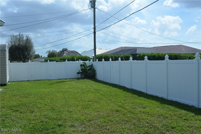 view of yard with a fenced backyard