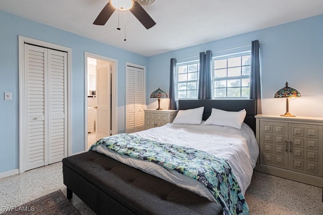 bedroom with ceiling fan, speckled floor, two closets, and baseboards