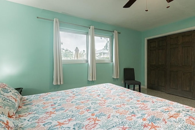 bedroom with a ceiling fan and a closet