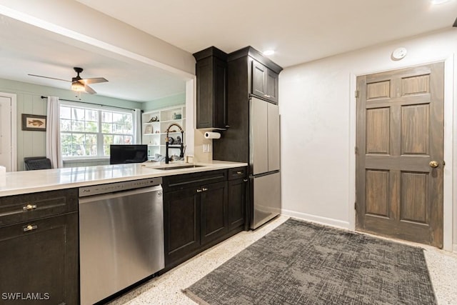 kitchen featuring light speckled floor, light countertops, a ceiling fan, a sink, and dishwasher