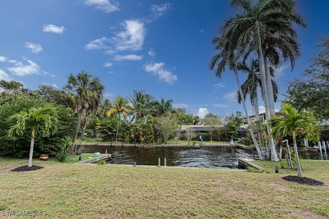 exterior space with a water view and a yard