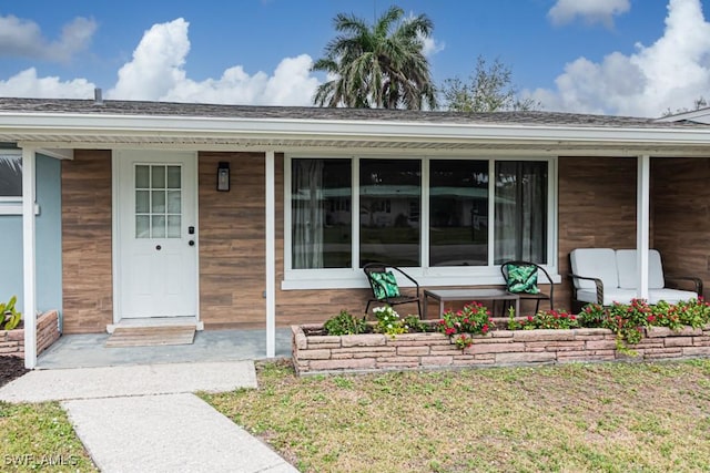 doorway to property with covered porch